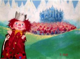 P'tit-Roi devant une colline verte, hautes montagne, ville et château en arrière-plan