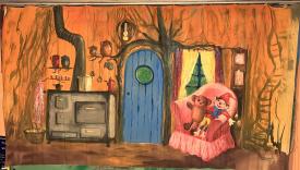 Salon avec poêle, fauteuil et doudous