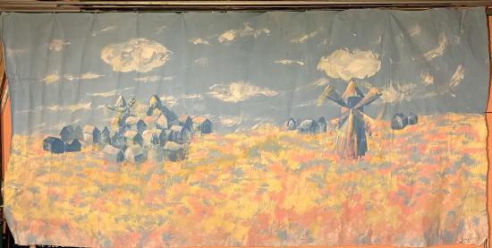 Champ de blé avec village et moulin